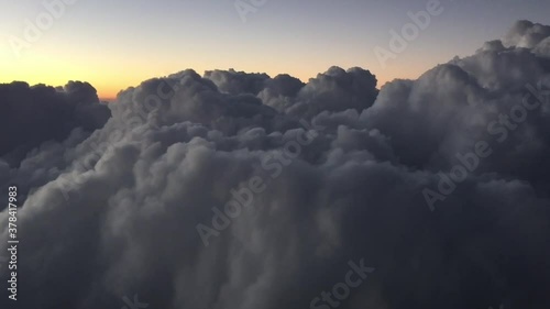 climbig through the clouds on the sunset photo