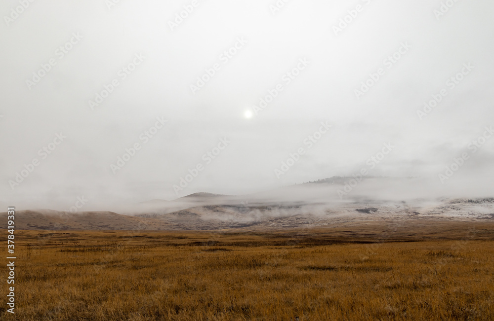 Dreary, foggy, empty, and barren winter landscape at the National Bison Range wildlife refuge, Montana, USA