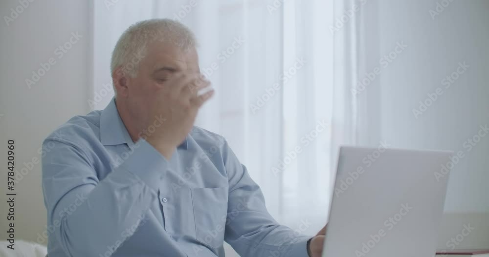 tired and exhausted office worker is feeling headache during work with laptop in daytime, feeling bad at workplace tired and exhausted office worker is feeling headache during work with laptop in daytime, feeling bad at workplace