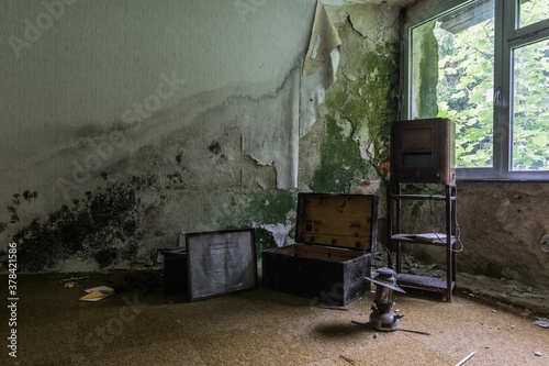 radio lamp and box in a moldy room