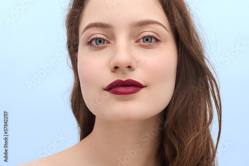 Canvas Print Girl with burgundy lipstick on her lips