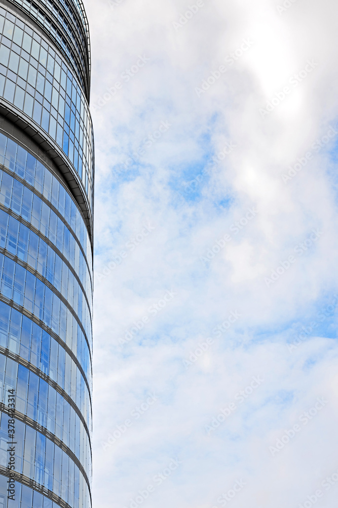 fragment of a high-rise, round, glass building, business center, modern urban architecture fragment of a high-rise, round, glass building, business center, modern urban architecture