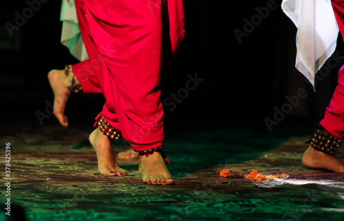 indian classical dance form in feet with musical anklet with selective focus and blur photo