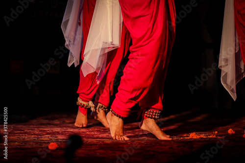 indian classical dance form in feet with musical anklet with selective focus and blur