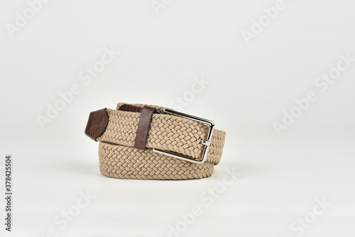 Trouser braided beige belt on a white background
