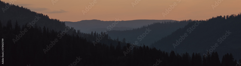 Naklejka Panoramic shot of Carpathian mountains chain at sunset