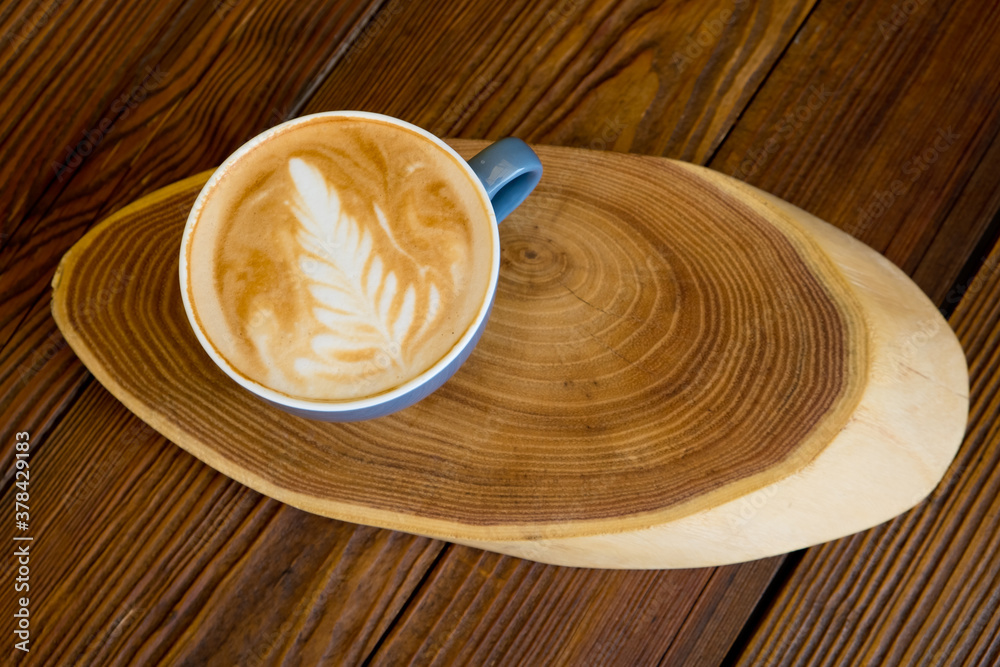 Coffee in a cup on a wooden table with copyspace. Top view. Coffee in a cup on a wooden table with copyspace. Top view.