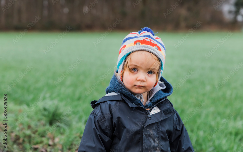 Toddler girl portrait in front of field Toddler girl portrait in front of field
