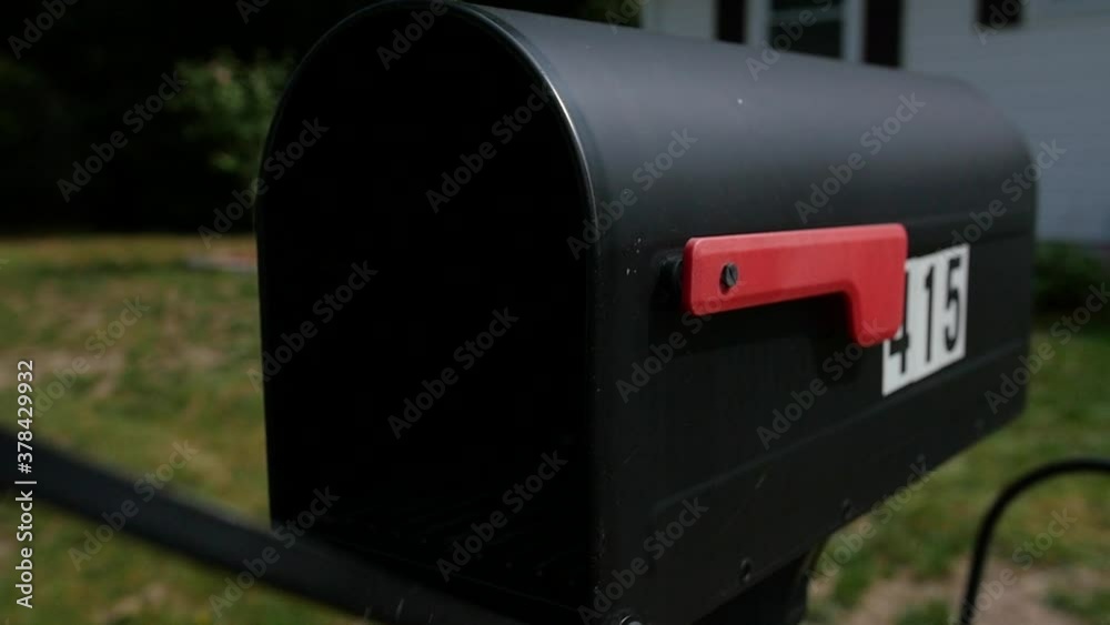 Slow Motion Placing Mail-In Ballot into Mail Box for Post Office Delivery during Election. Slow Motion Placing Mail-In Ballot into Mail Box for Post Office Delivery during Election.