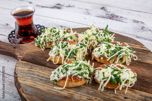 Traditional Turkish pastry pogaca with cheese filling with dill. Turkish name: Sakalli, sacakli, corek - pogaca. photo