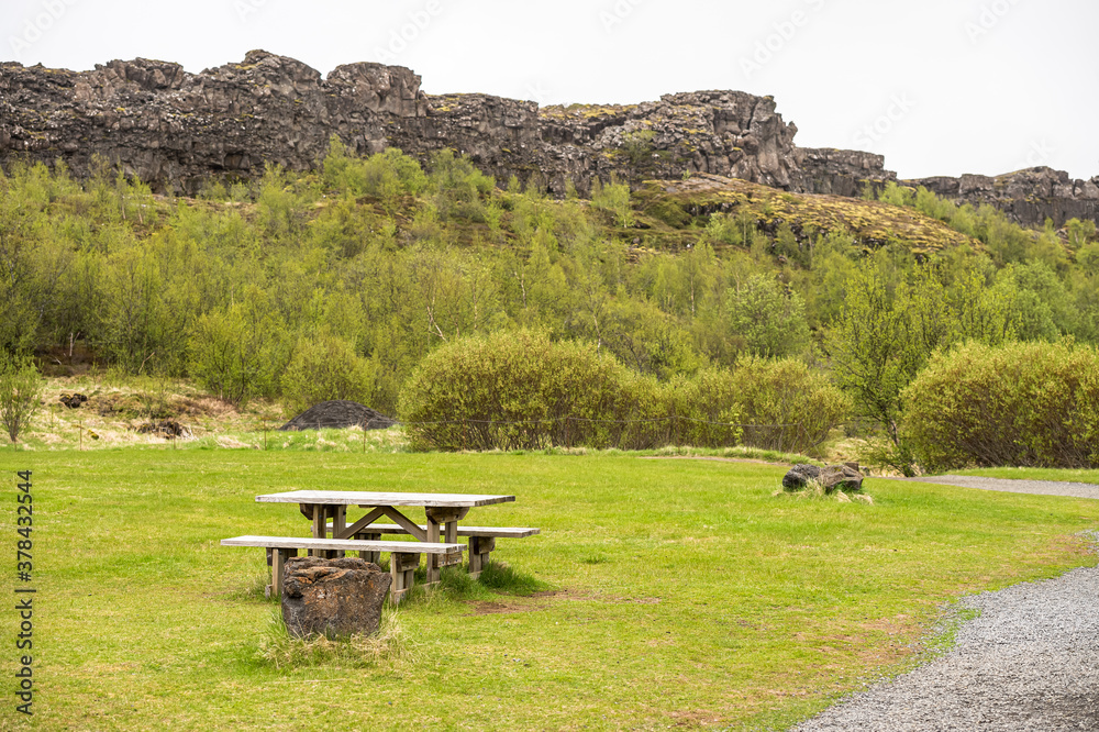 Obraz premium A lonely bench inside the Thingvellir Nationl Park, Iceland.