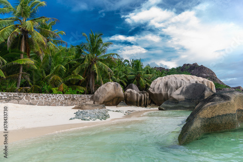 Beautiful tropical beach Anse Source d´Argent with sculpted granite rocks and palm trees. Seychelles is the most beautiful tropical islands of the world's in the Indian Ocean.