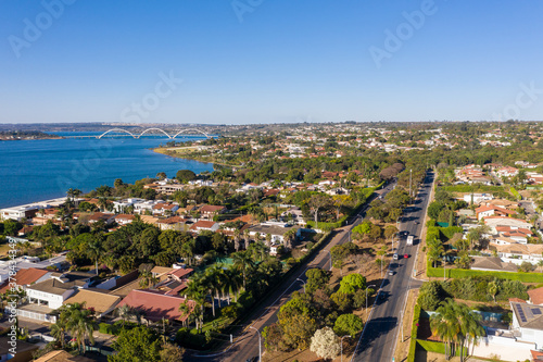 Fototapeta Naklejka Na Ścianę i Meble -  Aerial view of Brasilia's JK bridge and its South Lake neighborhood.