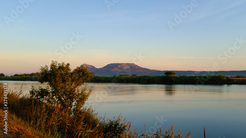 Plain mountains landscape in Montgri Catalonia at the end of Ter River sunrise landscape