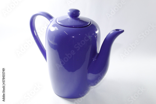 Blue ceramic milk jug with white background