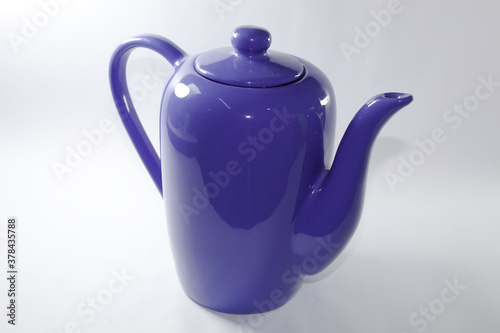 Blue ceramic milk jug with white background