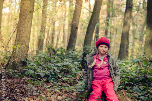 cute child in colorful woodland