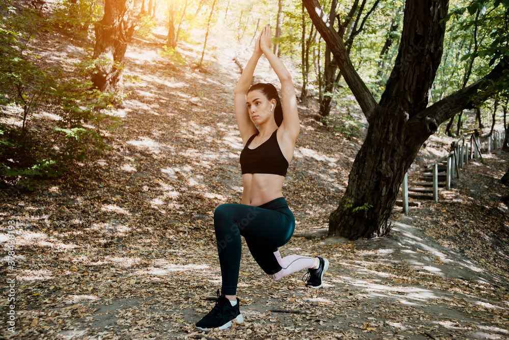 Athletic woman with a strong body does different exercises Athletic woman with a strong body does different exercises