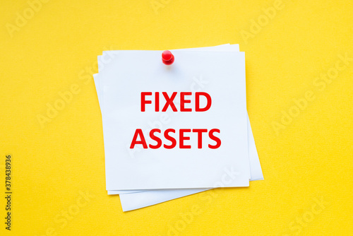 Fixed assets. Word on white sticker with yellow background