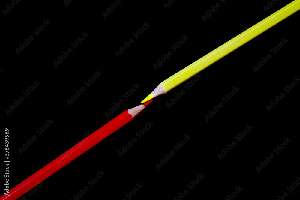red and yellow pencils are beautifully designed on a dark black background, a great picture of a combination of red and yellow colors red and yellow pencils are beautifully designed on a dark black background, a great picture of a combination of red and yellow colors