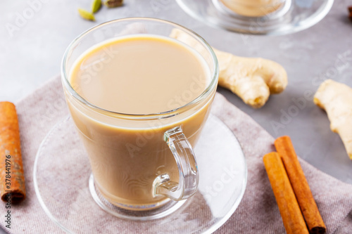 Masala chai tea. Traditional indian drink - masala tea with spices on gray background. Top view