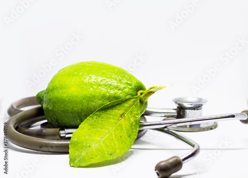 stethoscope and isolated aroma king lemon in white background with space for test photo