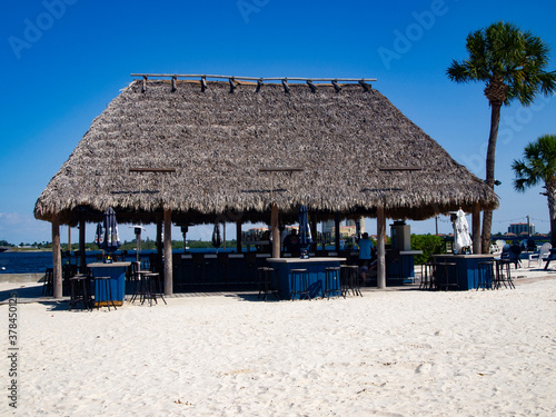 Tropical Tiki Bar on Manatee River, Bradenton Florida featuring its white sand and blue sky