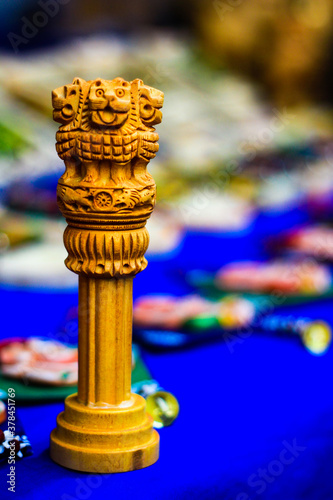 miniature wooden replica of Ashoka Stambha. An ancient historic indian monument.Lion face Pliiar of Ashoka, Indian national emblem. photo