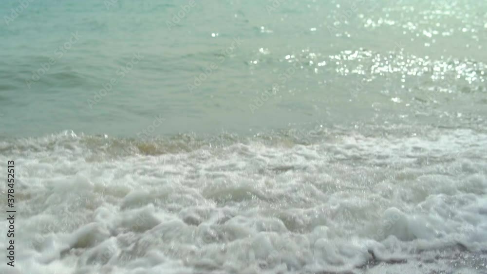Sea surf, beautiful waves, on the pebble beach beat,. slowly glistening water Sea surf, beautiful waves, on the pebble beach beat,. slowly glistening water