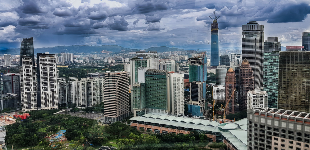 Fototapeta premium Kuala Lampur, Malaysia - November 2017. Photograph of the Kuala Lampur city from top of petronas twin tower showing modern highrise buildings.