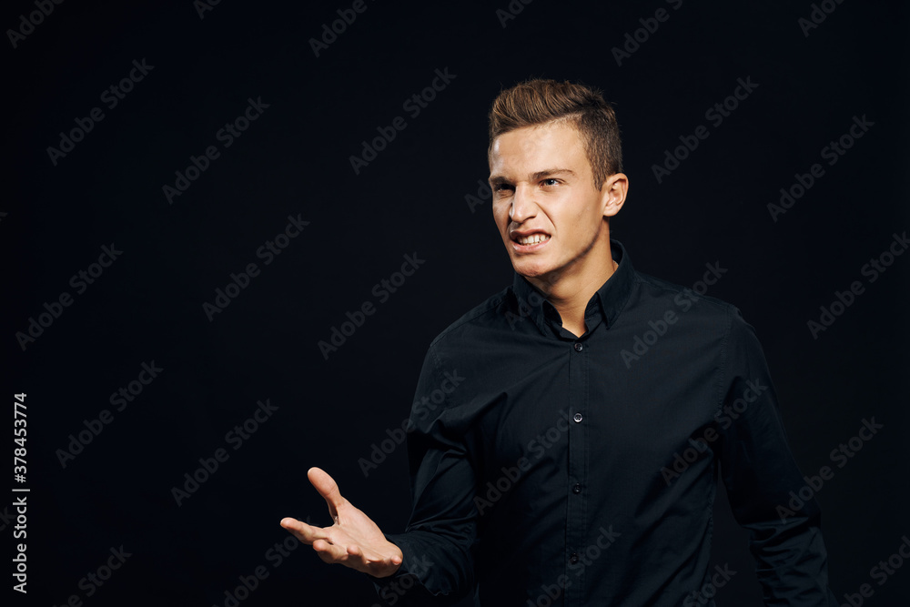 emotional man in black shirt lifestyle yellow isolated background emotional man in black shirt lifestyle yellow isolated background