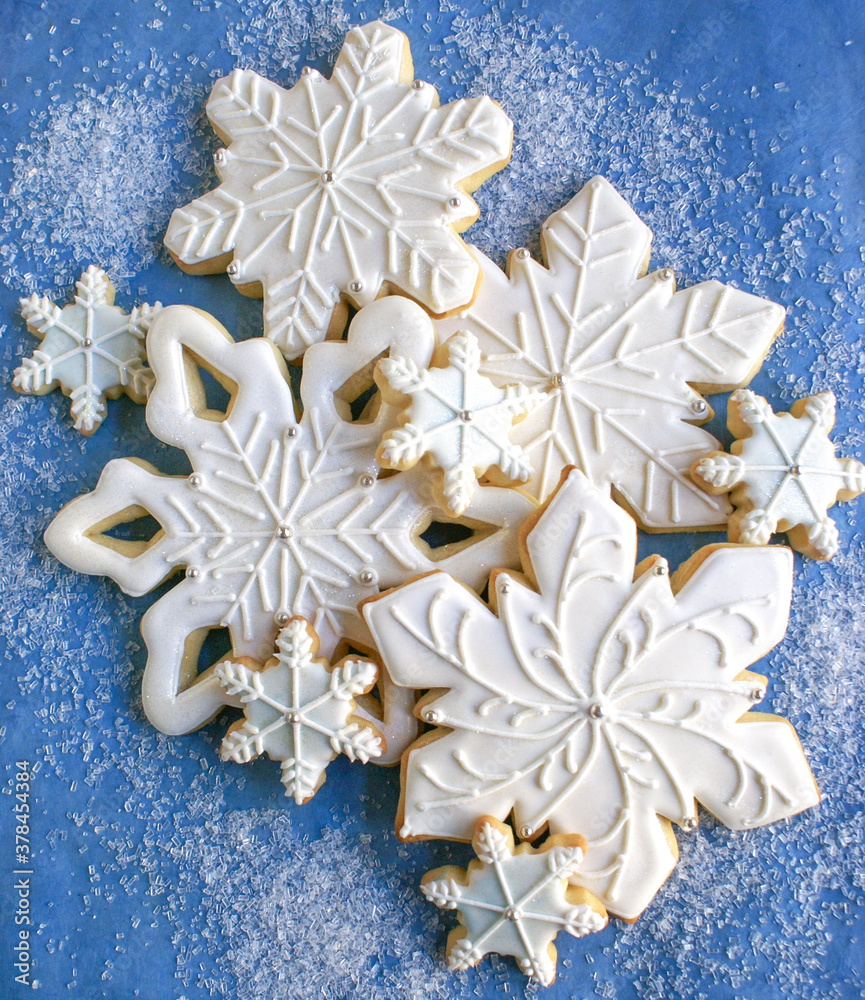 Decorated White and Blue Cut-Out Snowflake Sugar Cookies for Holidays and Winter
