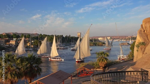 Beautiful landscape with felucca boats on Nile river in Aswan at sunset, Egypt, timelapse 4k