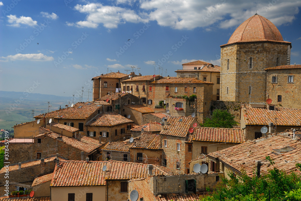 Rooftop view of the Baptistry dome and Volterra Valley in Tuscany