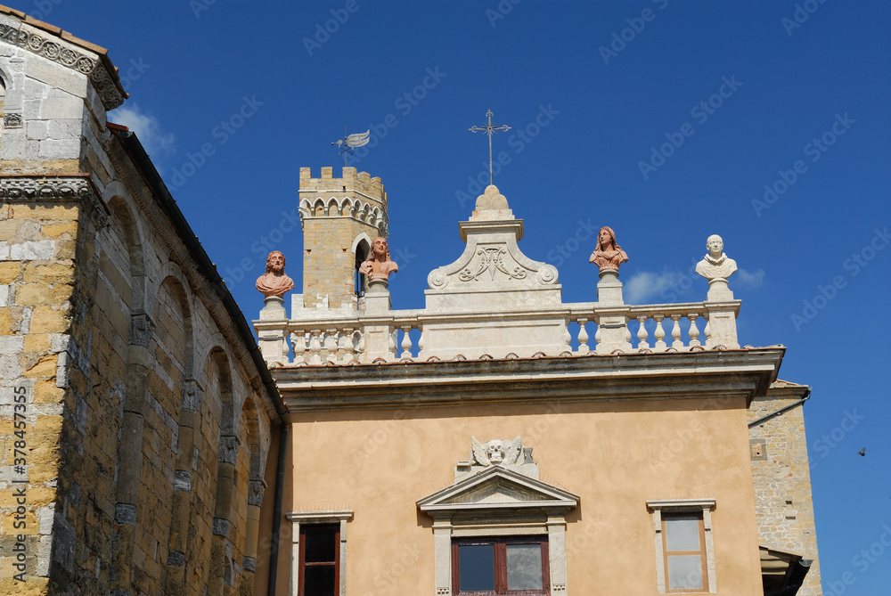 Side view of the Duomo in Volterra and the Palazzo dei Priori tower