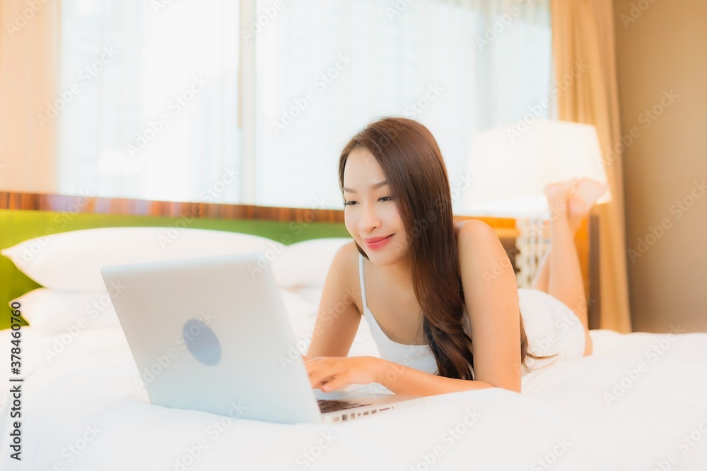 Portrait beautiful young asian woman use computer laptop on bed Portrait beautiful young asian woman use computer laptop on bed