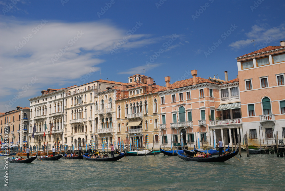 Row of gondoliers plying the Grand Canal in Venice