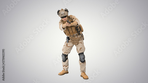 American soldier with pistol aiming and shooting on gradient bac