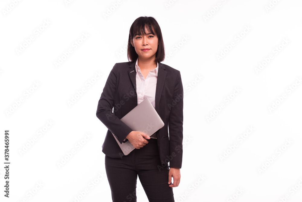 Asian woman working laptop Business women are busy working on laptop computers at the studio. The background is white Asian woman working laptop Business women are busy working on laptop computers at the studio. The background is white