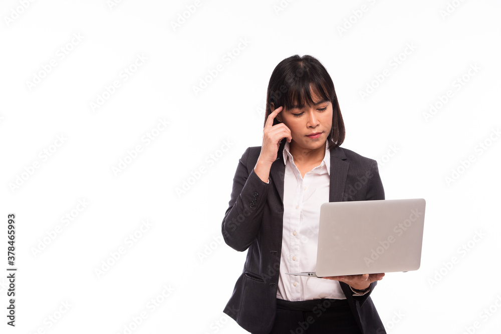 Asian woman working laptop Business women are busy working on laptop computers at the studio. The background is white Asian woman working laptop Business women are busy working on laptop computers at the studio. The background is white