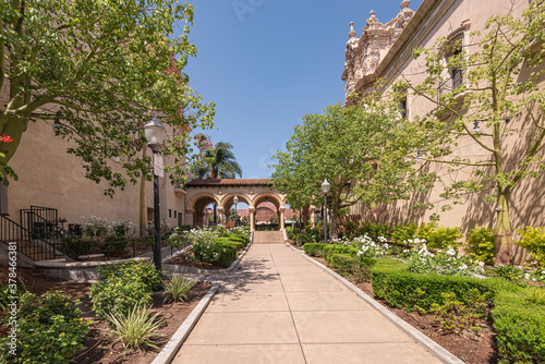 Balboa Park outdoor corridor between buildings and garden.