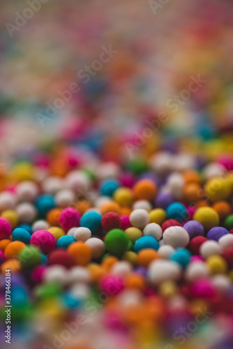 Macro close up portrait of colorful candy sprinkles , studio lighting, selective focus