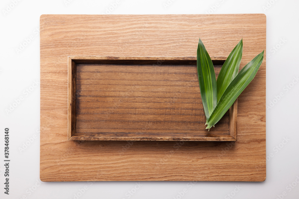 A square wood tray isolated white, top view at the studio. A square wood tray isolated white, top view at the studio.