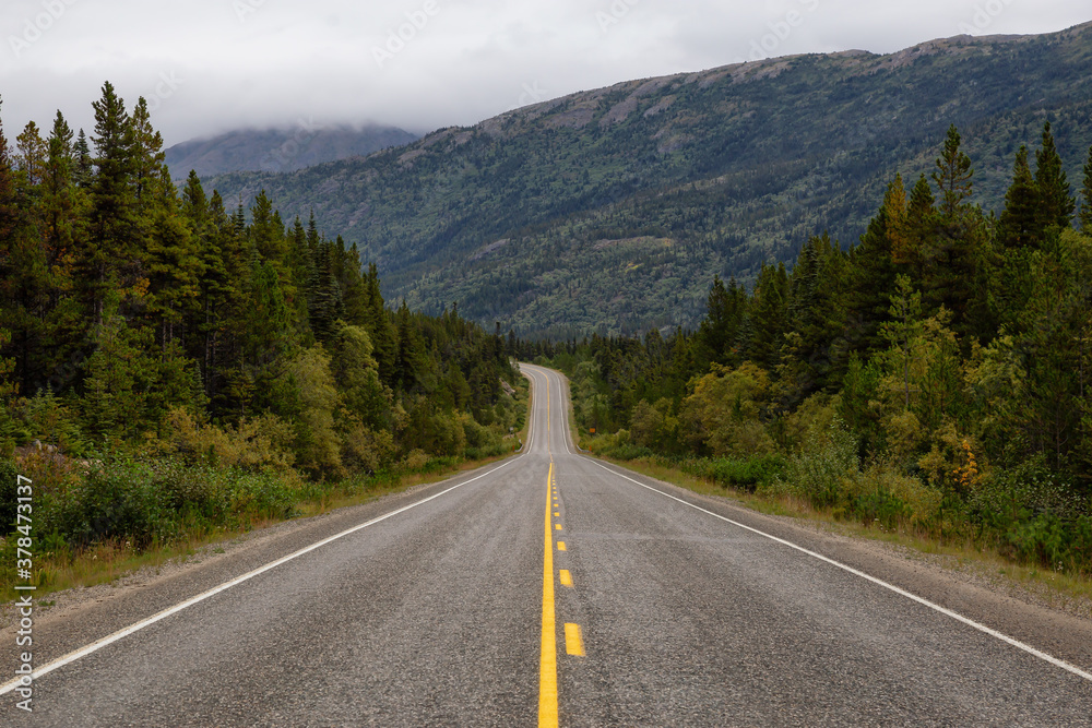 Beautiful Scenic Road, Klondike Hwy, in the Canadian Nature during Fall Season. Taken in Yukon, Canada. Beautiful Scenic Road, Klondike Hwy, in the Canadian Nature during Fall Season. Taken in Yukon, Canada.