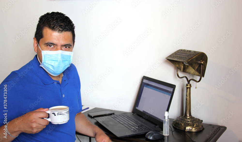 latin man with protection mask and antibacterial gel, working in home office and drinking coffee, new normal
latin man with protection mask and antibacterial gel, working in home office and drinking coffee, new normal