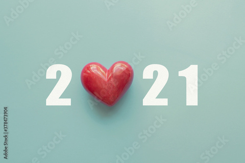 2021 with red heart. Happy New Year for heart health insurance, donation and medical concept, New Year resolutions goal