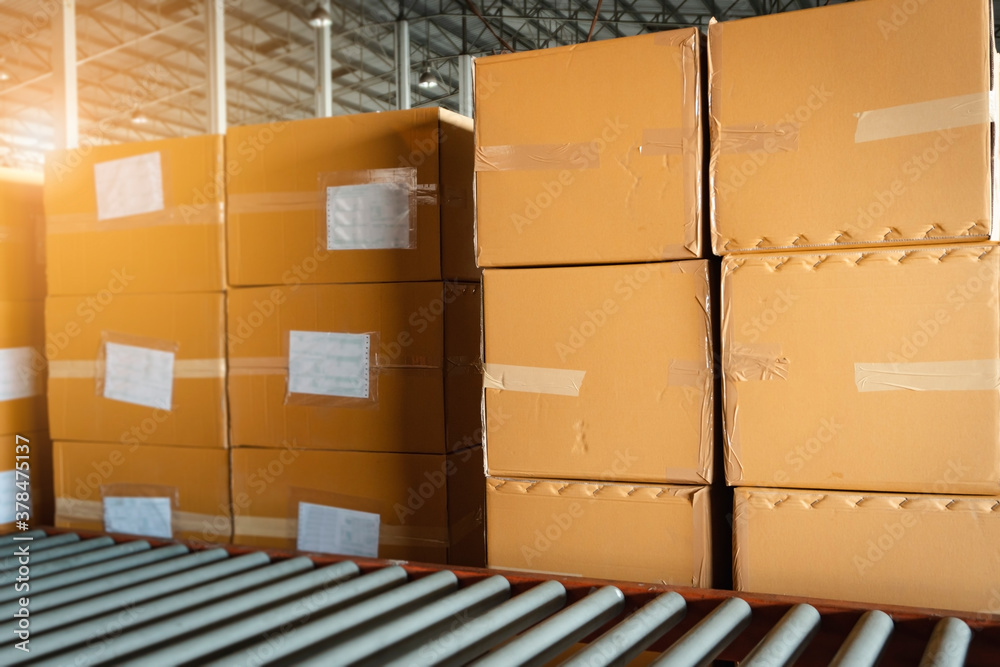 Shipment, Delivery service, Distribution warehouse. Stack of cartons product boxes at the warehouse storage. Shipment, Delivery service, Distribution warehouse. Stack of cartons product boxes at the warehouse storage.