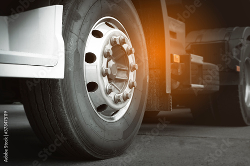 Close-up large a truck wheels and tires of semi truck trialer. photo