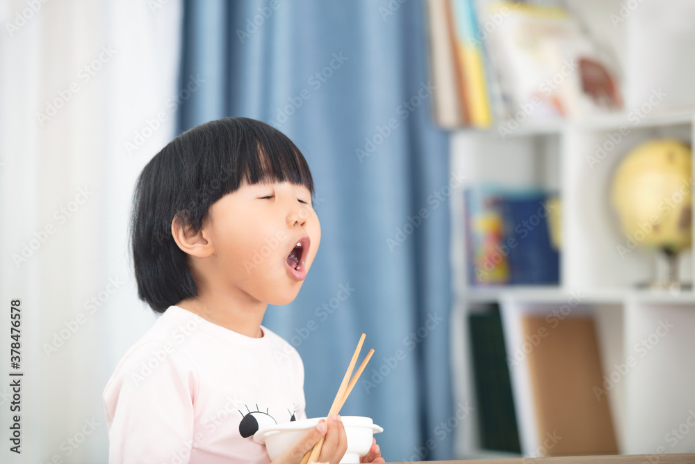 Girl with exaggerated expression at meal Girl with exaggerated expression at meal