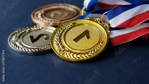 concept for winning or success. Gold medal, silver medal and bronze medal on yellow background. video stock footage photo